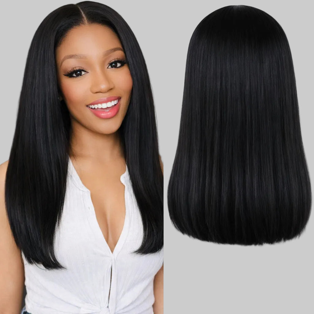 Woman with long black hair next to a wig on a mannequin head.
