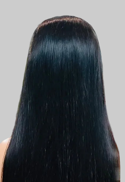 Person with long, straight black hair in an indoor setting