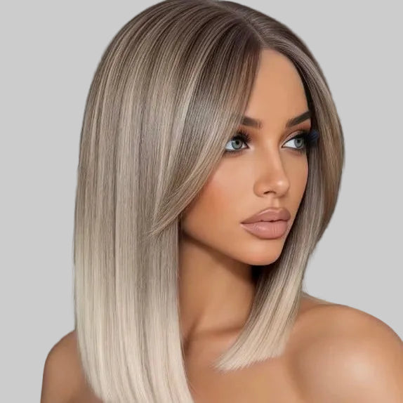 Woman with long, styled hair in a neutral indoor setting